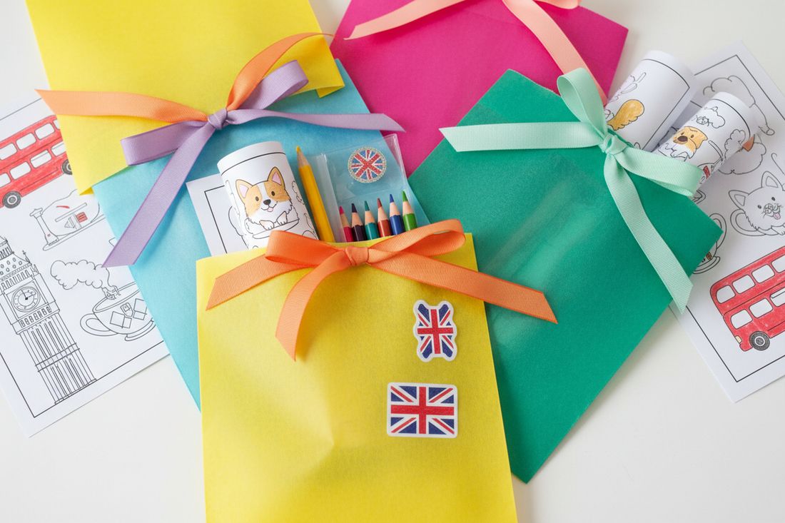 Colourful children's party bags filled with printed colouring pages and mini pencil sets on a white surface
